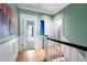 Upstairs hallway leading to bedrooms and a laundry room at 189 Westminster Dr, Atlanta, GA 30309