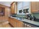 Kitchen featuring stainless steel appliances, granite counters, wood cabinets and a window at 189 Westminster Dr, Atlanta, GA 30309