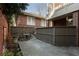 Private brick patio features stone tile and a fenced perimeter at 189 Westminster Dr, Atlanta, GA 30309