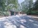 Beautifully renovated single-story home with modern shutters and a large driveway at 221 Wonewok Dr, Canton, GA 30114