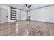 Large living room featuring hardwood floors, white walls, recessed lights, and dual sliding door access at 221 Wonewok Dr, Canton, GA 30114