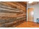 Hallway featuring an accent wall of wooden planks and hardwood floors at 3180 Mathieson Ne Dr # 806, Atlanta, GA 30305