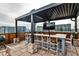 Enjoy the skyline views from this rooftop deck with bar seating and outdoor cooking space at 3180 Mathieson Ne Dr # 806, Atlanta, GA 30305