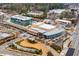 Aerial view of a commercial district with modern buildings, roadways, and landscaping, showcasing urban development and accessibility at 325 Wynland Trce, Sandy Springs, GA 30350