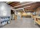 Expansive unfinished basement with utility fixtures and exposed ceiling structures at 325 Wynland Trce, Sandy Springs, GA 30350