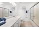 Well-lit bathroom featuring a vanity with a sink and a shower with sliding glass doors at 325 Wynland Trce, Sandy Springs, GA 30350