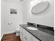 Bathroom featuring granite countertop and modern lighting with mirror at 325 Wynland Trce, Sandy Springs, GA 30350