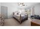 Cozy bedroom with decorative iron bed, plush carpet, and natural light from the windows at 325 Wynland Trce, Sandy Springs, GA 30350