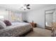 Cozy bedroom featuring plush carpet and a decorative iron bed bathed in natural light from the window at 325 Wynland Trce, Sandy Springs, GA 30350