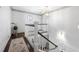 Bright hallway showcasing classic staircase with white railings and gleaming hardwood floors at 325 Wynland Trce, Sandy Springs, GA 30350