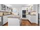 Beautiful kitchen featuring white cabinets, granite countertops, and stainless steel appliances at 325 Wynland Trce, Sandy Springs, GA 30350