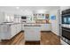 Bright kitchen with white cabinets, granite countertops, and stainless steel appliances at 325 Wynland Trce, Sandy Springs, GA 30350