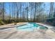 Backyard pool with a spa and a spacious patio, perfect for relaxing and enjoying the outdoors, great for summer fun at 325 Wynland Trce, Sandy Springs, GA 30350