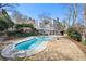 Backyard featuring a kidney-shaped pool with a concrete surround and multi-tiered deck at 325 Wynland Trce, Sandy Springs, GA 30350