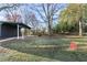 Sprawling backyard with a shed and mature trees, offering ample space for outdoor activities at 4013 Oglesby Rd, Powder Springs, GA 30127