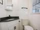 Well-lit bathroom with a modern vanity, matte black fixtures, and classic subway tile at 4013 Oglesby Rd, Powder Springs, GA 30127