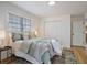 Cozy bedroom with a comfortable bed, stylish area rug, and natural light from the window at 4013 Oglesby Rd, Powder Springs, GA 30127