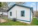 Quaint white home featuring blue trim, a fenced yard, and an air conditioning unit at 819 Humphries St, Atlanta, GA 30310