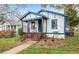 Home featuring a covered porch and landscaped front yard at 819 Humphries St, Atlanta, GA 30310