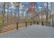 Spacious wooden back deck with black metal railings overlooking wooded property at 137 Creekview Dr, Woodstock, GA 30188