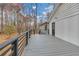 Spacious back deck with gray planks and black metal railings, offering serene outdoor living space at 137 Creekview Dr, Woodstock, GA 30188