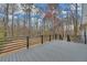Backyard deck is spacious and perfect for outdoor entertainment. It is surrounded by trees and a beautiful landscape at 137 Creekview Dr, Woodstock, GA 30188