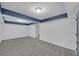Basement with gray carpet, white walls and blue trim, ready for your personal touch at 137 Creekview Dr, Woodstock, GA 30188