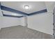 Finished basement area with neutral carpet, recessed lighting, and fresh paint at 137 Creekview Dr, Woodstock, GA 30188