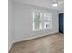 Bedroom with lovely hardwood flooring and a large window that gives you natural light at 137 Creekview Dr, Woodstock, GA 30188