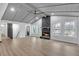 Bright living room with stone fireplace and abundant natural light at 137 Creekview Dr, Woodstock, GA 30188