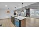 Open concept with modern kitchen and fireplace with lots of natural light at 137 Creekview Dr, Woodstock, GA 30188