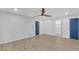 Spacious main bedroom with a ceiling fan, wood flooring, and two closets at 137 Creekview Dr, Woodstock, GA 30188