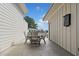 Outdoor patio with wood chairs, a small table, and a serene backyard view at 2712 Stargazer Ter, Smyrna, GA 30080