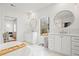 Bright bathroom featuring marble floors, double vanities, soaking tub, and gold fixtures at 2712 Stargazer Ter, Smyrna, GA 30080