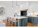 Bright kitchen features a large island with seating and modern pendant lighting at 2712 Stargazer Ter, Smyrna, GA 30080