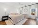 Bright main bedroom featuring wood floors and large windows at 2712 Stargazer Ter, Smyrna, GA 30080