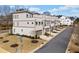 View of modern townhomes with sidewalks and well-maintained landscaping at 2712 Stargazer Ter, Smyrna, GA 30080