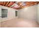 Finished basement area with carpet, wood paneling, and windows for natural light at 4240 Parnell Rd, Marietta, GA 30062