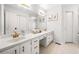 Bathroom with white cabinets, double sinks, and a large mirror above the vanity at 4240 Parnell Rd, Marietta, GA 30062