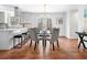 Dining room featuring modern furniture, hardwood floors, and an adjacent kitchen at 4240 Parnell Rd, Marietta, GA 30062