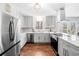 Modern kitchen with stainless steel appliances, quartz countertops, and stylish white cabinetry at 4240 Parnell Rd, Marietta, GA 30062