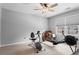 Bright bedroom featuring workout equipment, large windows, and neutral walls at 4350 White Surrey Nw Dr, Kennesaw, GA 30144