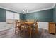 Traditional dining room with natural wood table and a window overlooking the yard at 4350 White Surrey Nw Dr, Kennesaw, GA 30144