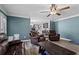 Cozy living room with a ceiling fan and gray wood floors at 4350 White Surrey Nw Dr, Kennesaw, GA 30144