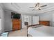 Light-filled main bedroom with furniture and an ensuite bathroom at 4350 White Surrey Nw Dr, Kennesaw, GA 30144