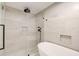 Modern bathroom with a glass enclosed shower and freestanding tub featuring stone colored tile at 6090 River Chase Cir, Atlanta, GA 30328