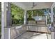 Elegant outdoor kitchen with stainless steel appliances, granite countertops, and stylish ceiling fan at 6090 River Chase Cir, Atlanta, GA 30328