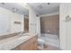 Cozy bathroom featuring a shower and tub combination, granite countertop, neutral colors, and lots of light at 3324 Peachtree Ne Rd # 1718, Atlanta, GA 30326