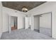 Bedroom with concrete ceilings, carpet floors, a closet, and multiple doorways at 3324 Peachtree Ne Rd # 1718, Atlanta, GA 30326