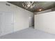 Bedroom featuring carpet floors, concrete ceilings, and a modern chandelier at 3324 Peachtree Ne Rd # 1718, Atlanta, GA 30326
